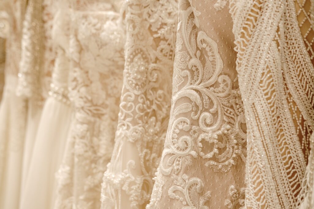Cream Wedding Dresses Hanging On The Hanger. Bridal Fashion Concept